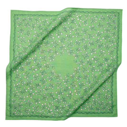 Kelly green cotton bandana with a cream calico floral pattern and decorative border shown loosely draped.