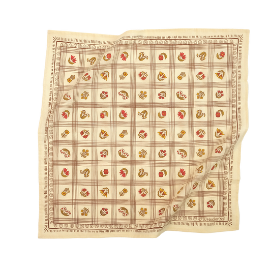 No. 130 Laura Bandana in creamy yellow cotton with brown grid print, rust and olive floral motifs, and decorative border.