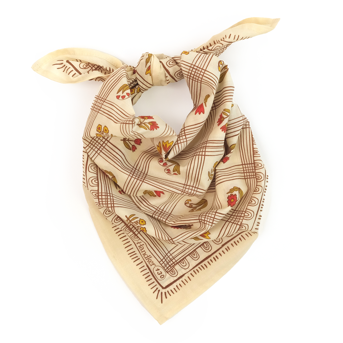 Creamy yellow No. 130 Laura Bandana with brown grid lines, rust floral details, and olive accents shown knotted on a white background.