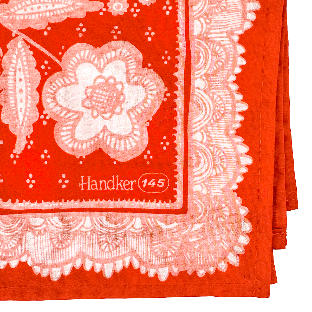 Folded Lacey Bandana showing the pink floral design, ornamental border, and printed corner detail.