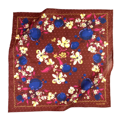 No. 150 Meg Bandana folded and tied to display its rich chocolate brown and jewel-toned floral print.