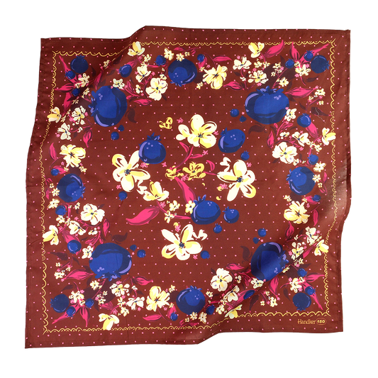 No. 150 Meg Bandana folded and tied to display its rich chocolate brown and jewel-toned floral print.