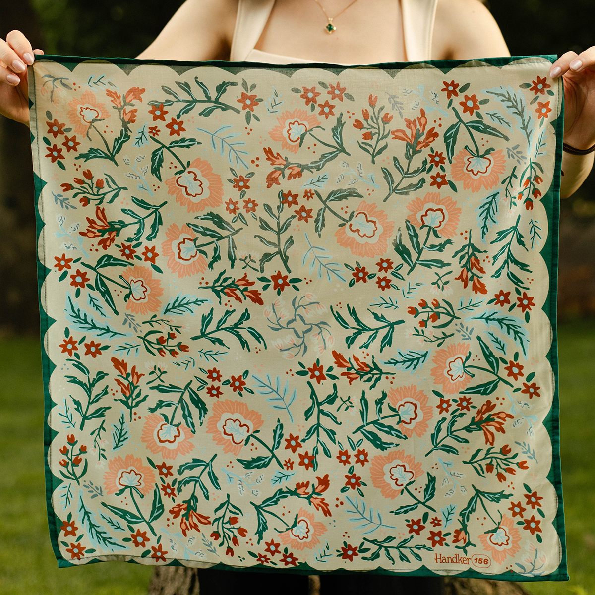No. 156 Willa Bandana held open to show its full botanical design and dark teal scalloped border.