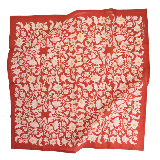 No. 159 Delphine Bandana laid flat with an intricate cream and ochre floral pattern on a poppy red background.
