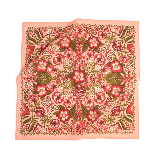 No. 500 Sylvia Bandana featuring a pink, green, and cream floral print with a soft peach border, shown laid flat.