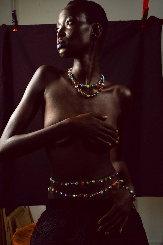 Model wearing the Paint Pot Waist Chain in Silver with colorful deadstock stones.