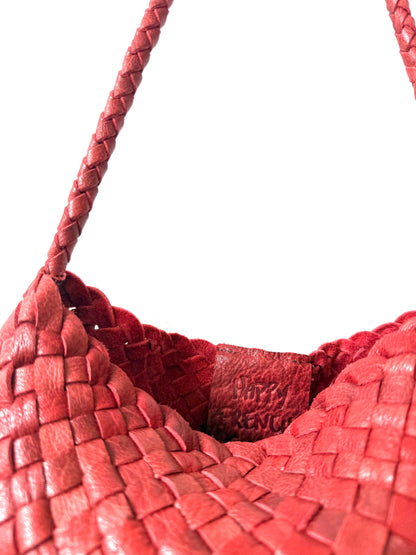 Close-up of the leather shoulder strap and open-top edge of the Palar Red Bag