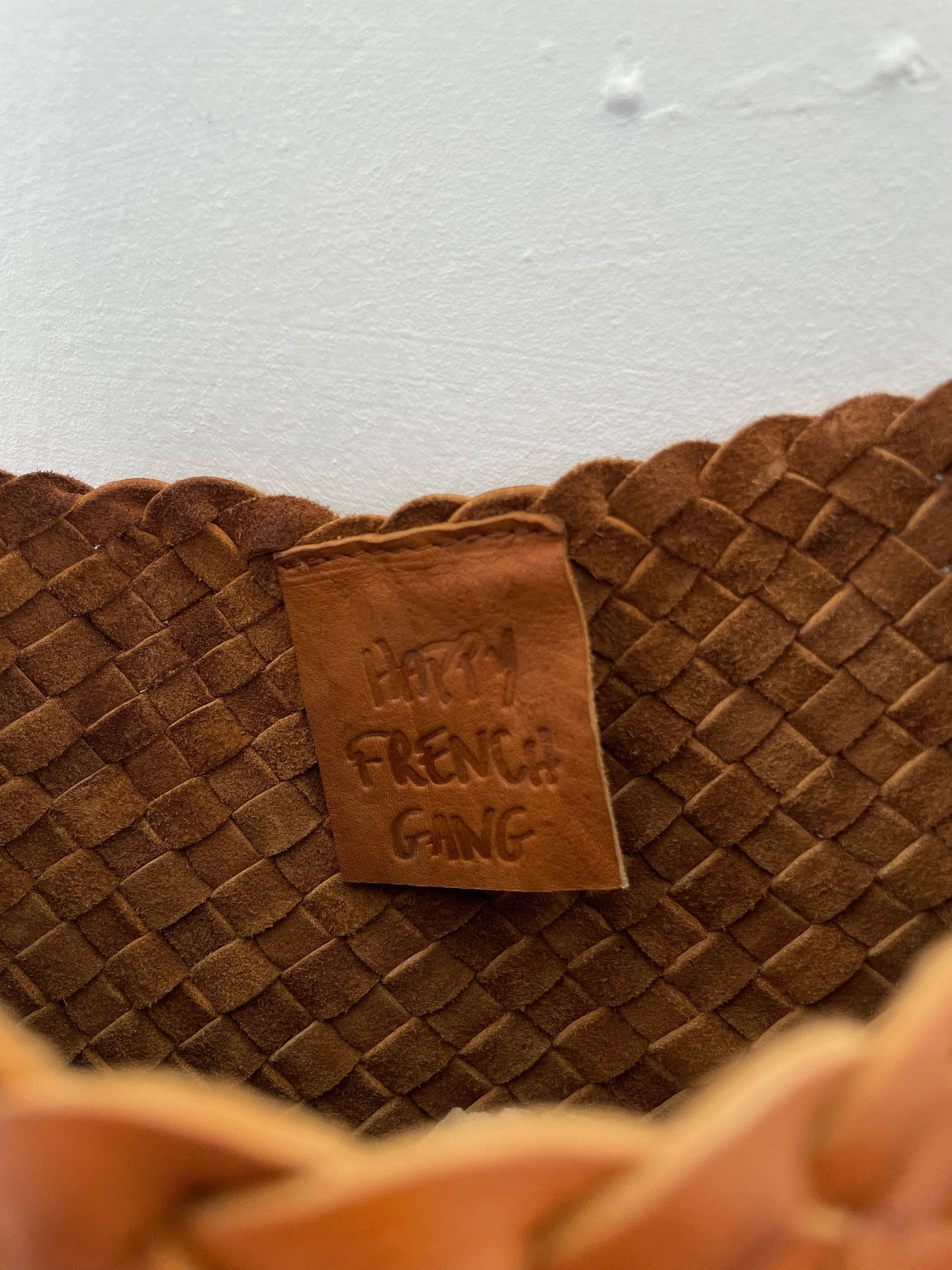 Close-up of the interior leather label and handwoven construction of the Palar Tan Bag