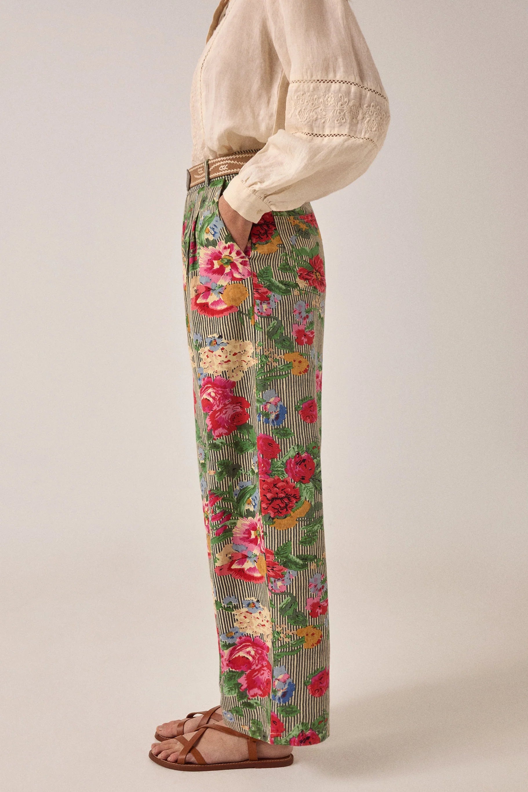 Side profile of Maison Hotel Pepe Pant in Hulton Soul Noir displaying the relaxed wide-leg silhouette, floral print, and vertical stripe pattern.