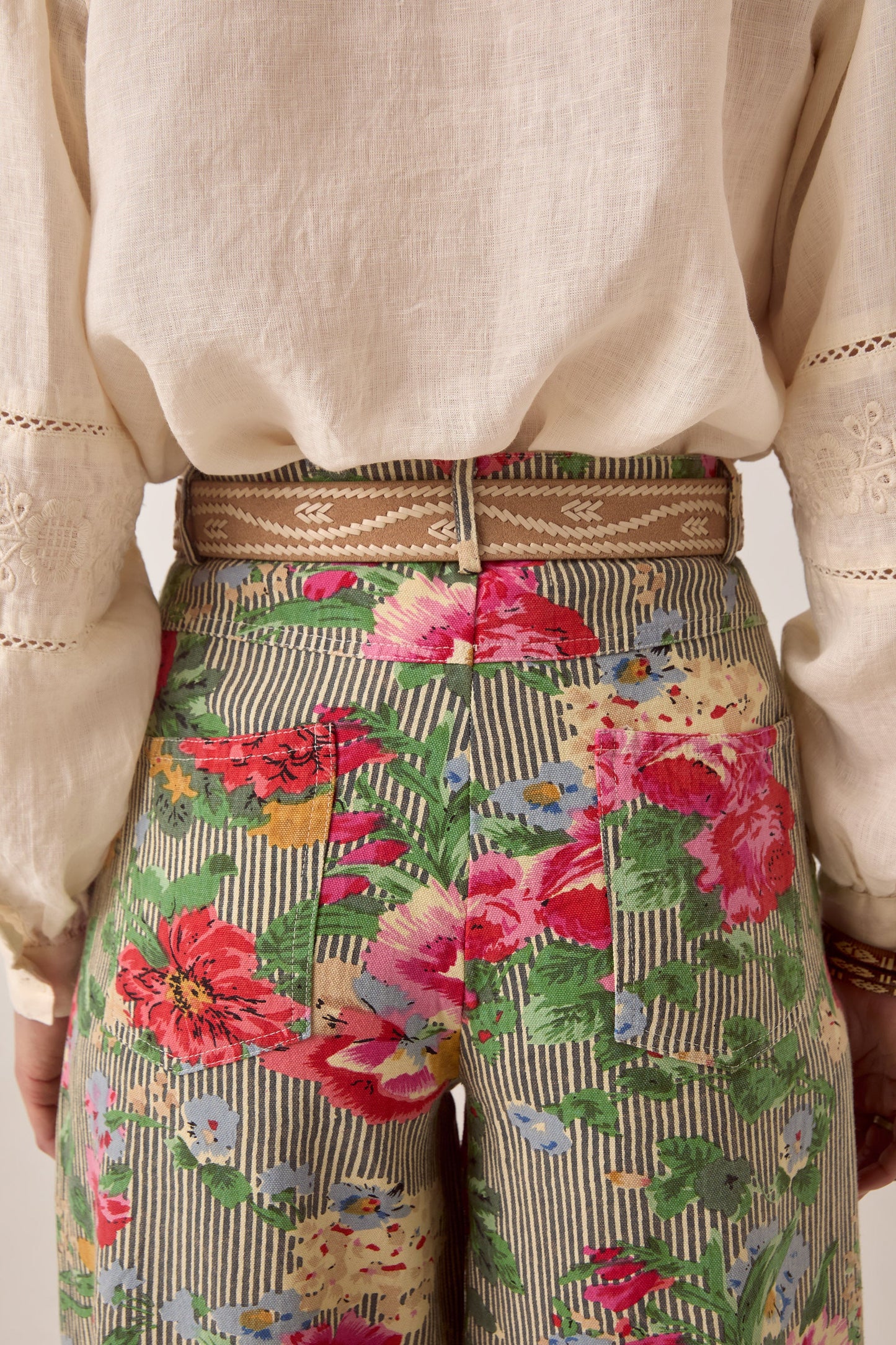 Close-up of the back waist and pockets of the Maison Hotel Pepe Pant in Hulton Soul Noir highlighting the floral stripe print and tailored finish.
