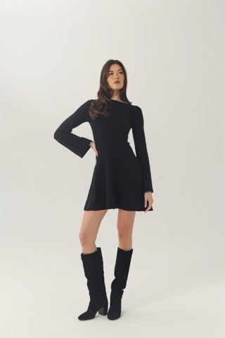 Angled full-length view of the black Prescott dress with a fitted bodice and flared skirt.