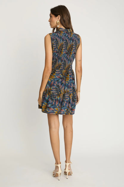 Back view of the Prue Dress in Midnight Palm featuring the sleeveless design, smocked back waist, and softly gathered skirt.