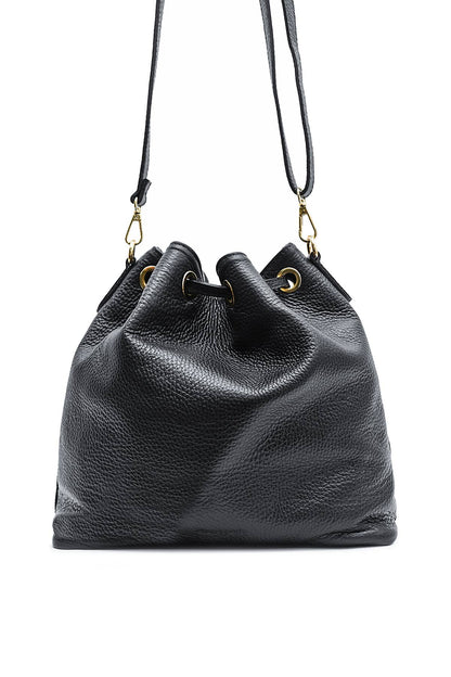 Back view of the Régine Suede Bag in noir suede with a softly gathered drawstring silhouette and long shoulder strap.