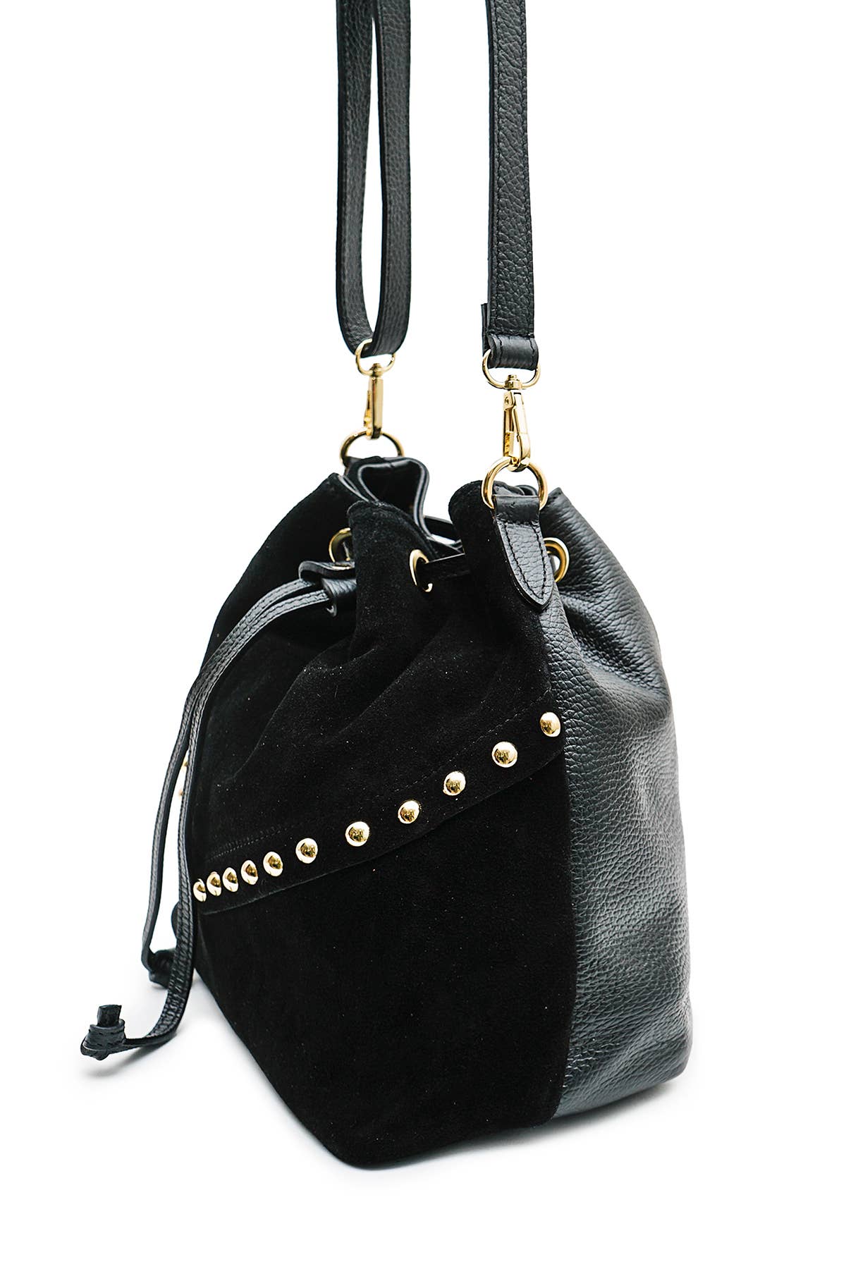Side view of the Régine Suede Bag in black suede, showing the structured base, stud detailing, and leather strap attachments.