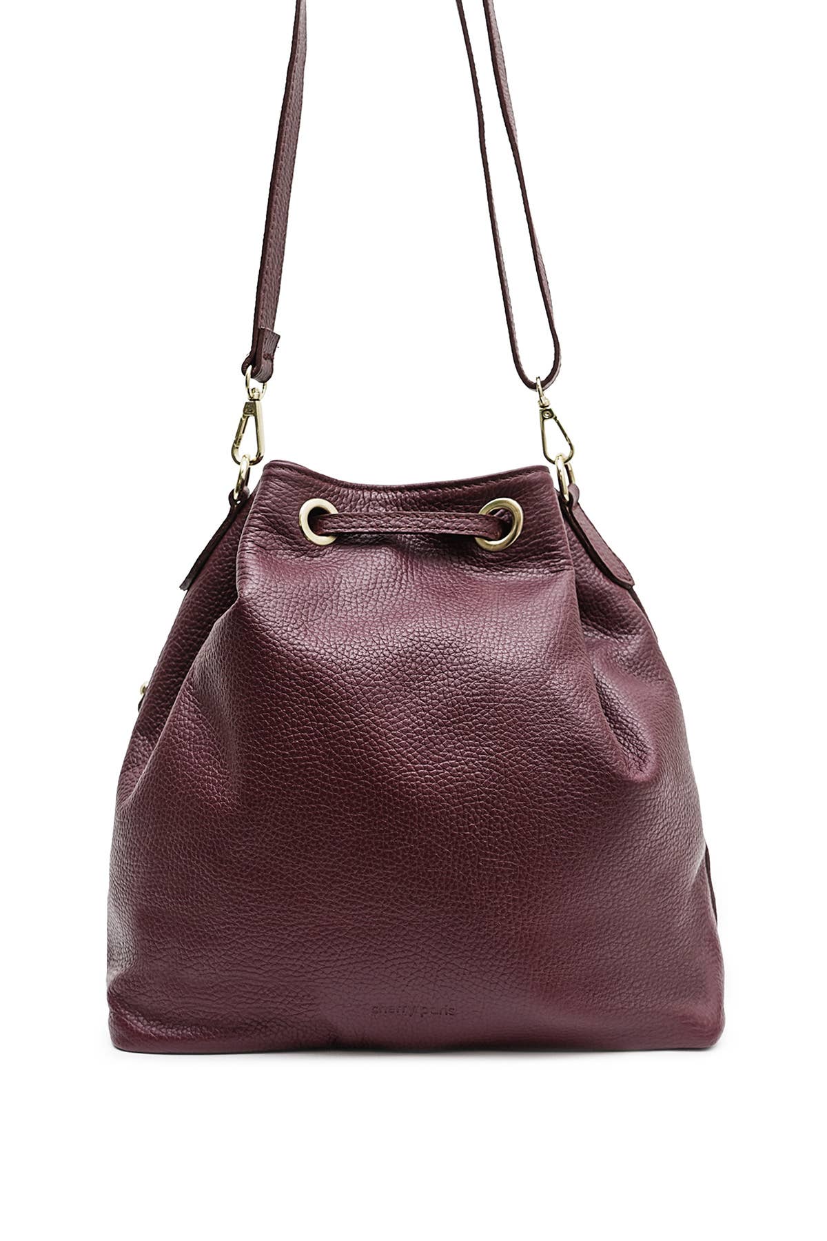 Back view of the Régine Suede Bag in bordeaux suede with its adjustable shoulder strap and leather trim.