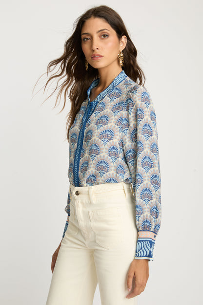 Side profile of the Riley Top in Boho Deco highlighting the fluid viscose drape, relaxed fit, gathered sleeves, and contrasting blue patterned cuffs.