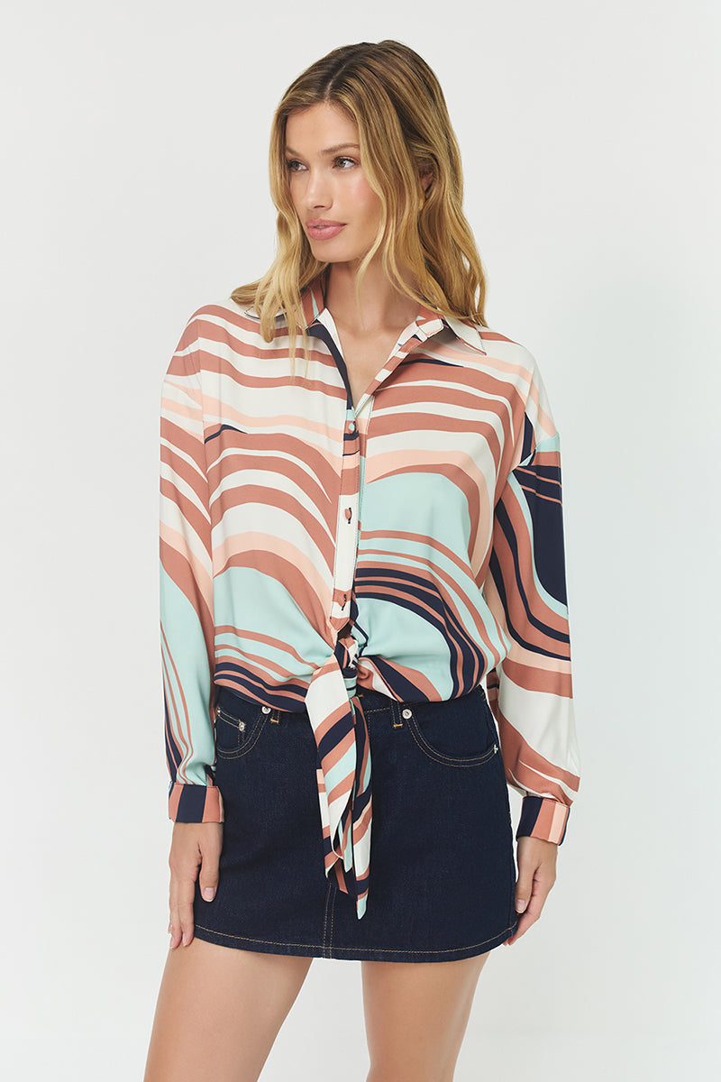 Front view of the Robbie Top showcasing its colorful wavy geometric print, relaxed satin silhouette, button-down design, and front tie detail.