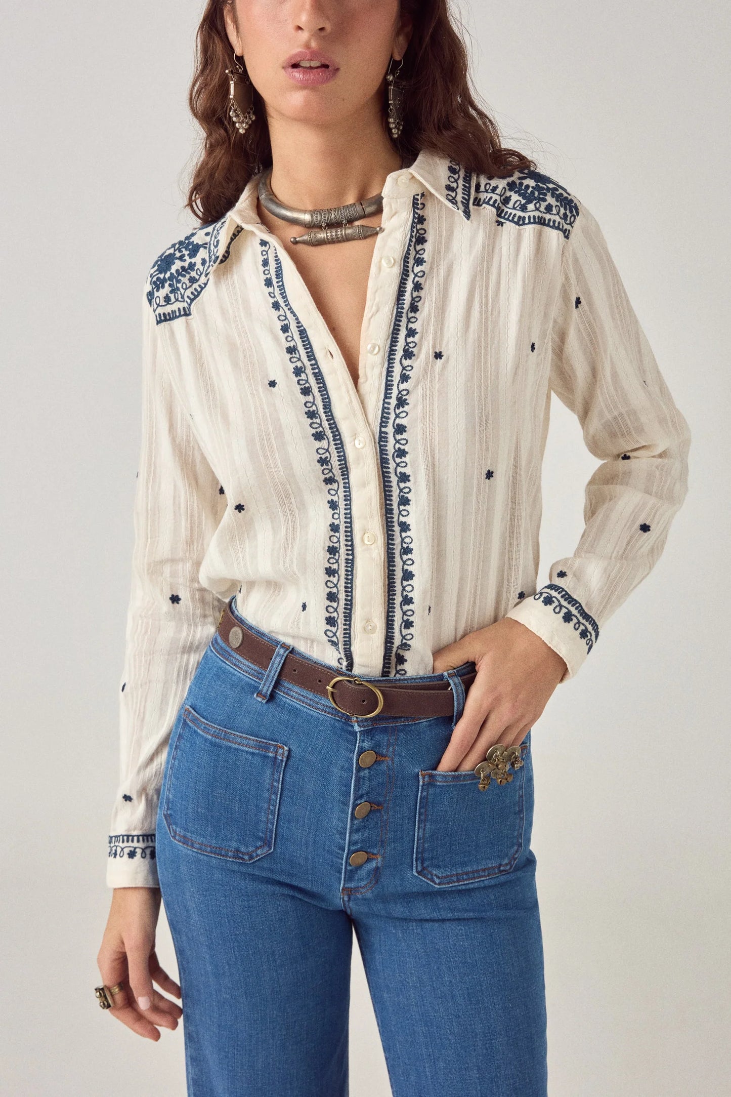 Front view of the Salinger Shirt in Cream Indigo showcasing embroidered placket detailing, navy floral motifs, button-down front, and relaxed fit.