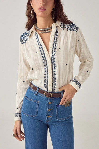 Front view of the Salinger Shirt in Cream Indigo showcasing embroidered placket detailing, navy floral motifs, button-down front, and relaxed fit.