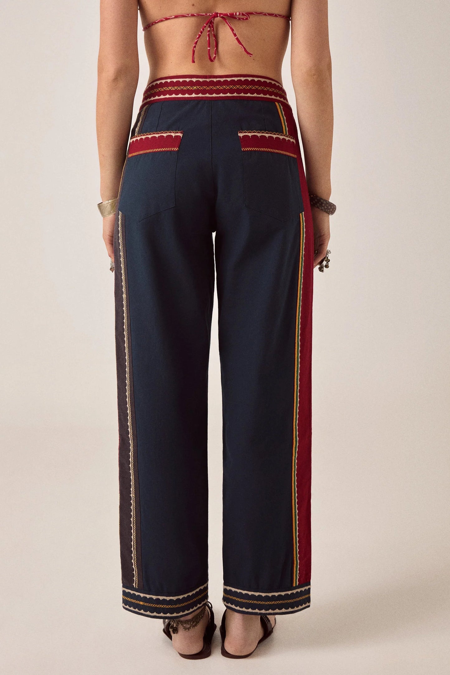 Back view of Samarkand Brahma Pants in Midnight Patch featuring decorative trim accents and rear pocket detailing