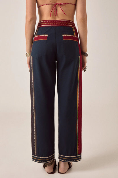Back view of Samarkand Brahma Pants in Midnight Patch featuring decorative trim accents and rear pocket detailing