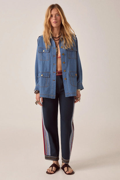 Model wearing Samarkand Brahma Pants in Midnight Patch paired with a striped utility jacket for a bohemian-inspired look