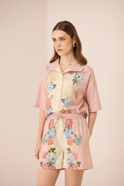 Angled front view of the Shea Shorts styled with the matching Shea Shirt, showing the floral print and relaxed fit.