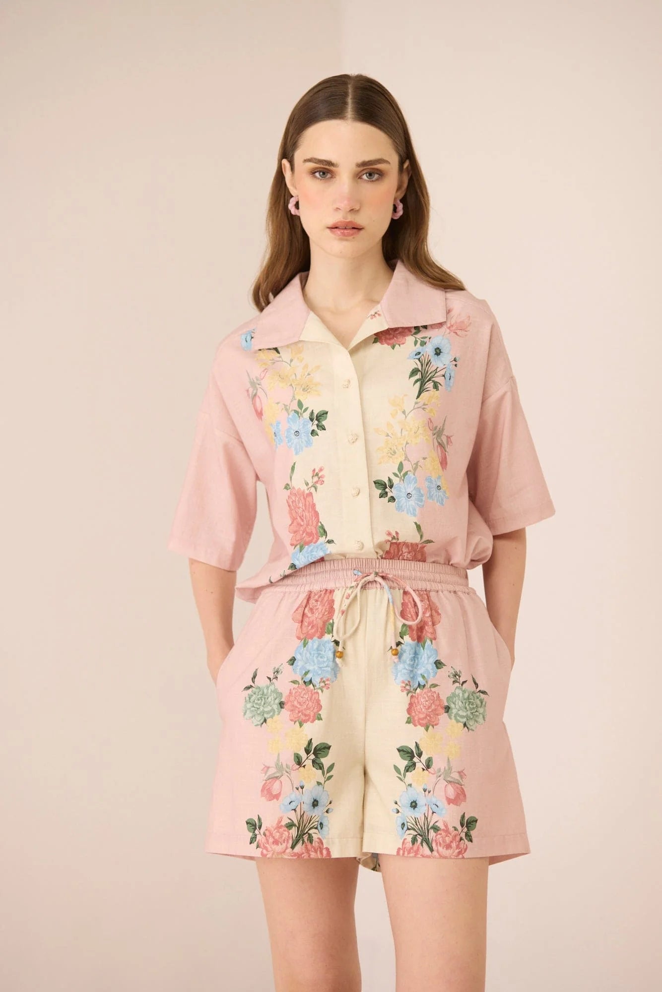 Model wearing the Shea Top with matching Shea Shorts for a coordinated blush and cream floral set.