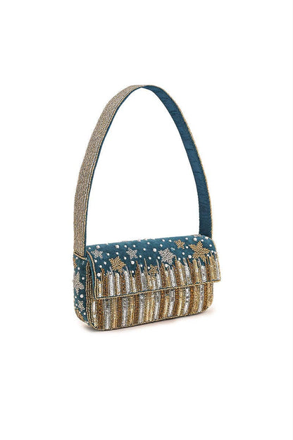Side view of the Star Beaded Party Shoulder Bag showing its structured shape, teal velvet body, metallic beadwork, and beaded strap.