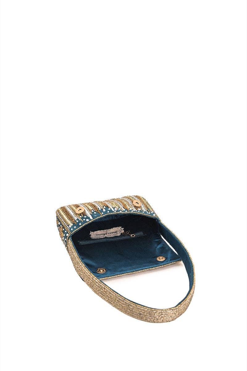 Top view of the Star Beaded Party Shoulder Bag showing the flap closure, teal satin lining, and beaded shoulder strap.
