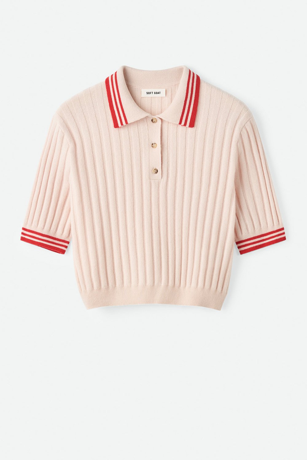 Flat lay image of the blush pink Striped Pique cashmere polo with ribbed texture and red striped collar and sleeve cuffs on a neutral background.