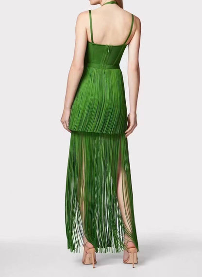Rear full-length view of the Sultry Green Fringe Halter Maxi Dress showcasing fluid fringe movement and elegant fitted back design.