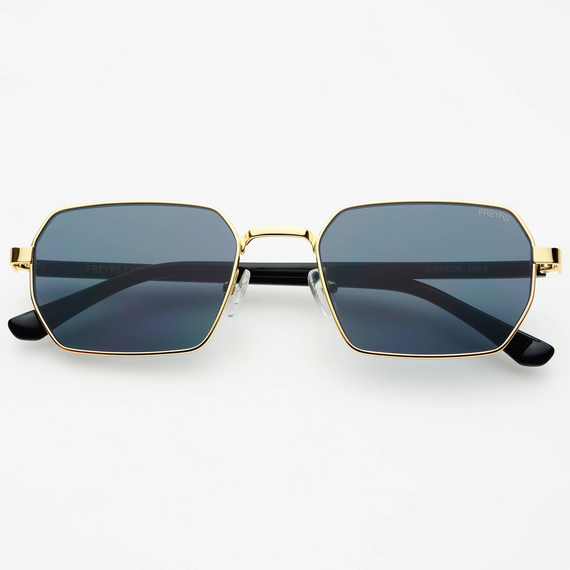 Front view of Superior unisex sunglasses featuring a gold stainless steel frame and gray lenses.