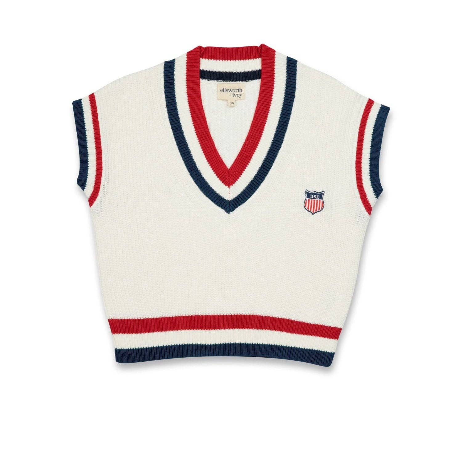 Off-white sleeveless sweater vest with red and navy striped trim and embroidered shield emblem.