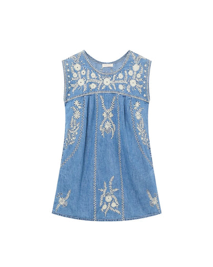 Full front flat lay of the Sylvie Arizona embroidered denim mini dress in Blue Haze with white floral and geometric embroidery