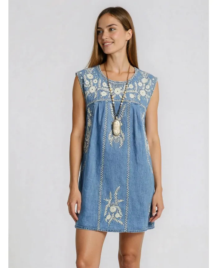 Model wearing the Sylvie Arizona embroidered denim mini dress in Blue Haze with relaxed A-line silhouette
