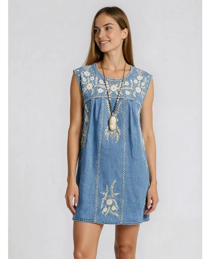 Model wearing the Sylvie Arizona embroidered denim mini dress in Blue Haze with relaxed A-line silhouette