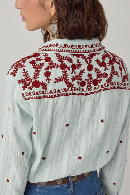 Back view of the Texas Sun Salinger Shirt in Blue Paprika featuring intricate burgundy floral embroidery across the shoulder yoke and scattered embroidered motifs on soft striped cotton.