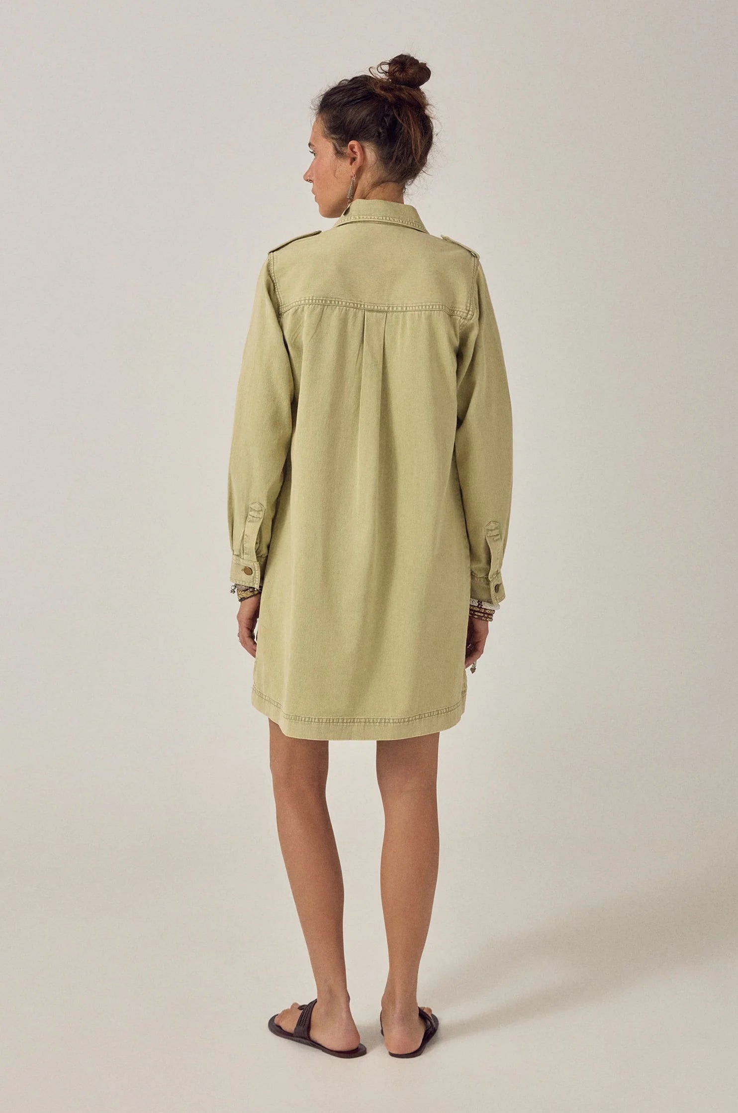 ack view of the Thalassa Short Dress in Army Khaki with a clean utility silhouette and long sleeves with epaulet detailing.