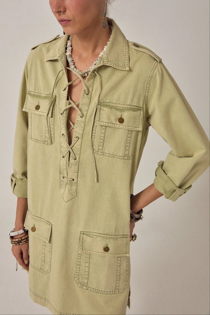 Close-up detail of the Thalassa Short Dress in Army Khaki showcasing the lace-up V-neckline, chest flap pockets, and soft cotton twill fabric.