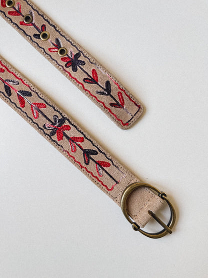 Detail view of the Thar Belt - Karma Thread with a brass oval buckle and embroidered desert suede strap.