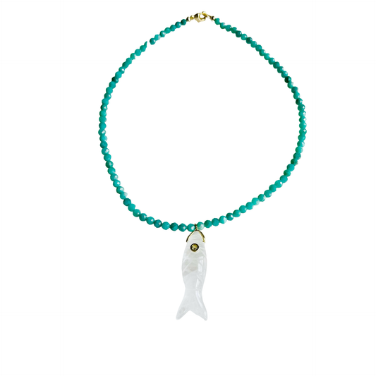 The Big Eye Fish Necklace featuring teal jade gemstone beads and a carved white quartz fish pendant with a gem eye detail on a white background.