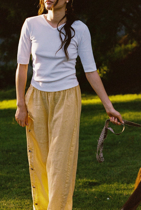 Full length view of Tilda Linen Pant in Sunflower featuring elastic waistband and wide leg silhouette