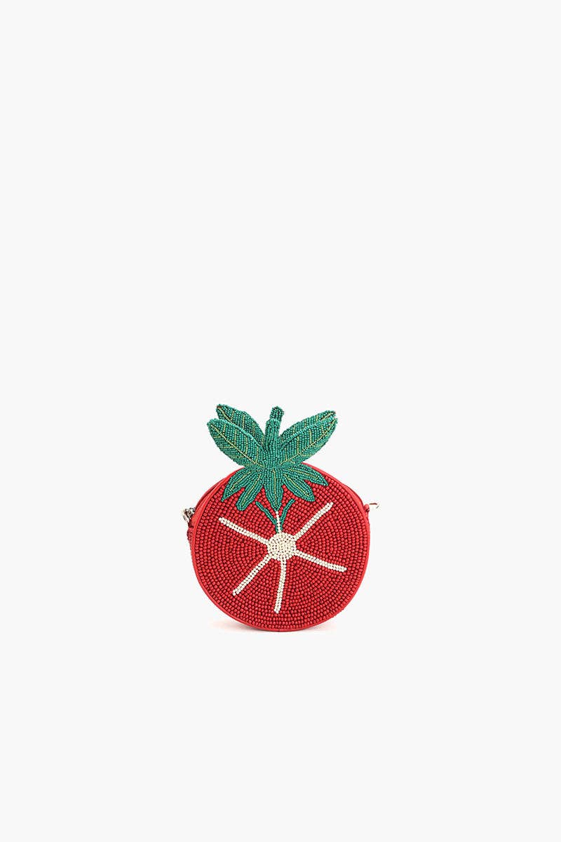 Angled view of the Tomato Tango Crossbody Bag featuring red beadwork, green leaf detailing, and a compact tomato shape.