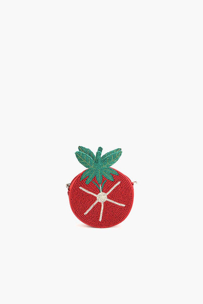 Angled view of the Tomato Tango Crossbody Bag featuring red beadwork, green leaf detailing, and a compact tomato shape.