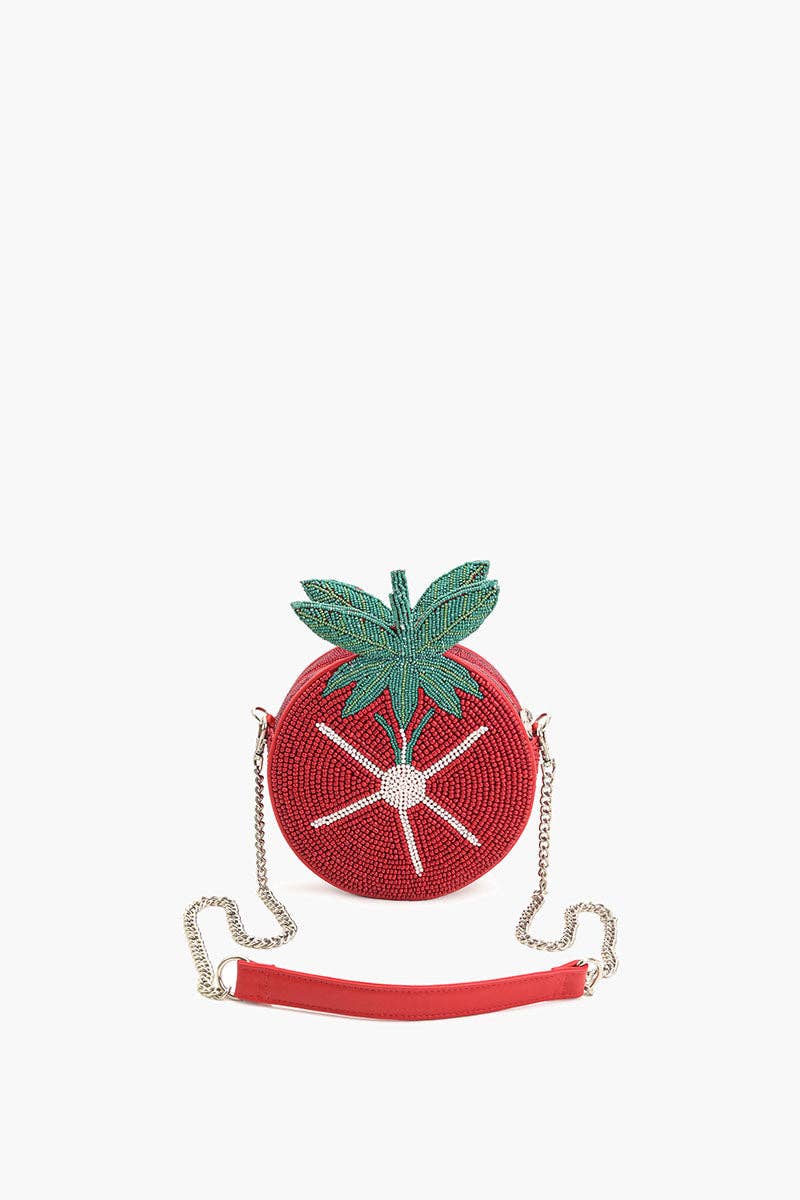 Tomato-shaped red beaded crossbody bag with green leaf top, white starburst bead detail, metal chain strap, and red PU shoulder padding.