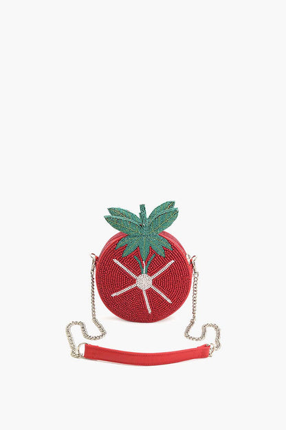 Tomato-shaped red beaded crossbody bag with green leaf top, white starburst bead detail, metal chain strap, and red PU shoulder padding.