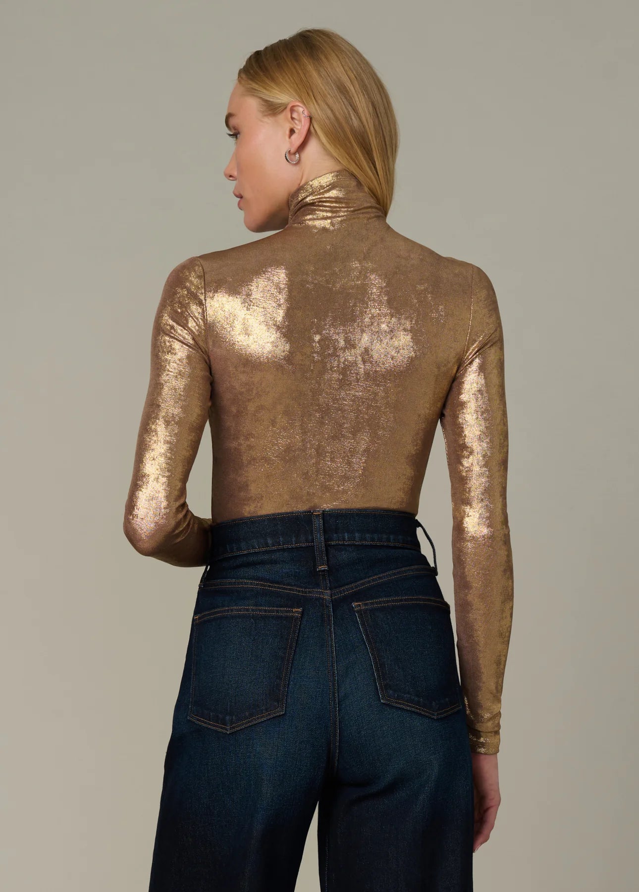 Back view of the Tony Top in metallic gold with long slim sleeves and a fitted silhouette.