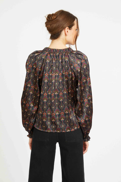 Back view of the Vickie Top featuring a gathered neckline, flowing satin silhouette, and all-over medallion-inspired bohemian print.