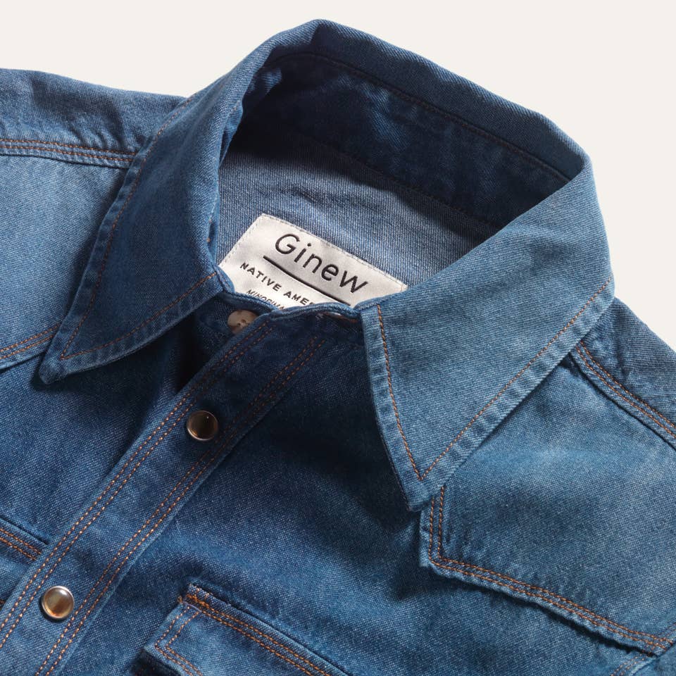 Close-up of the Western Snap Shirt in Washed Chambray featuring a pointed collar, Western front yoke, and vintage-inspired snap button closure.